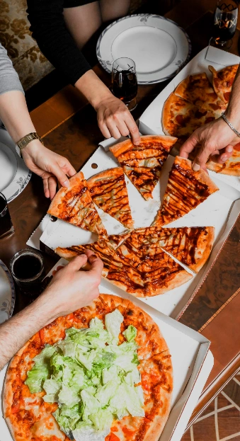 company friends eating pizza talking